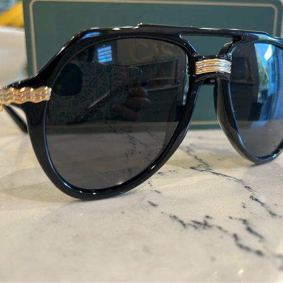 Stylish Black Sunglasses with Gold Accents